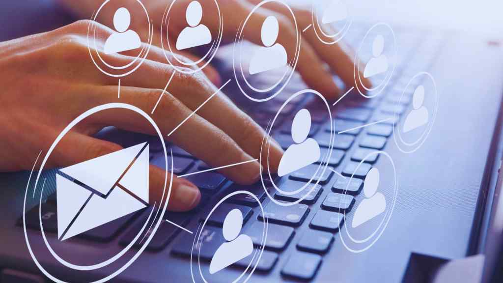 Hands typing on a laptop keyboard with overlay graphics of people icons connected by lines, symbolizing email communication and networking.